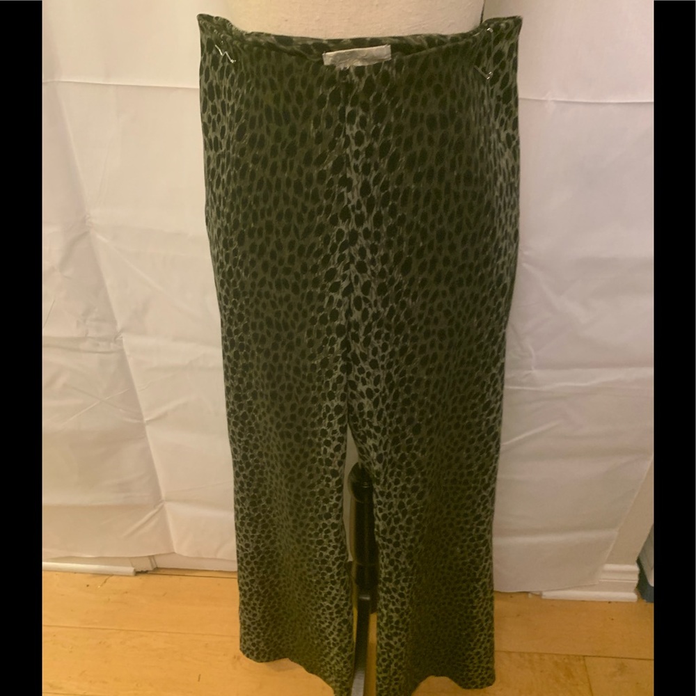 Cache dark green and black animal print pants.